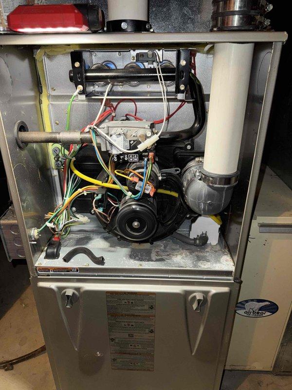 Performed comprehensive HVAC tune-up service on residential furnace system. Inspected interior components including motor assembly, wiring connections, and heat exchanger for proper operation. Examined connected PVC venting system to ensure proper installation and ventilation compliance with NSF standards.
