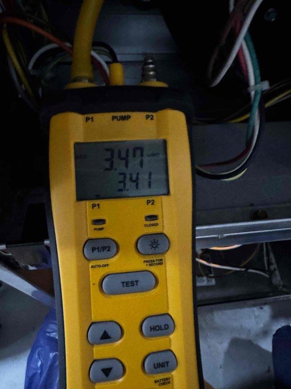 Performed routine maintenance inspection on HVAC system per agreement. Conducted pressure testing with digital diagnostic tool, recording pressure readings of 347 and 341 PSI. Inspected plumbing infrastructure and verified proper operation of shutoff valves in the mechanical space.