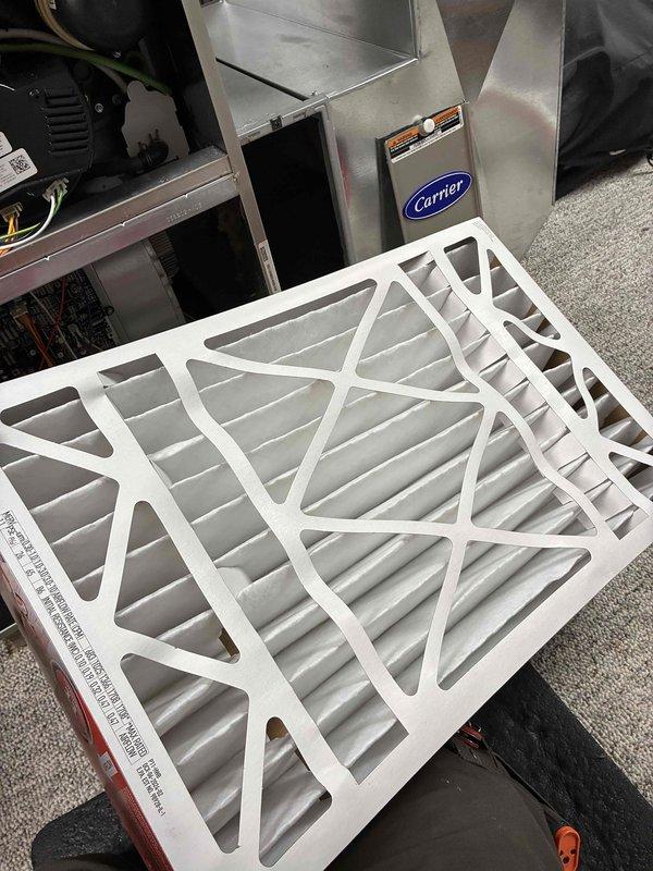 Performed scheduled maintenance on Carrier HVAC system. Replaced air filter and conducted electrical diagnostics using SC680 multimeter, measuring microamp draw (4.1 μA) to verify proper system operation. All components functioning within normal parameters.