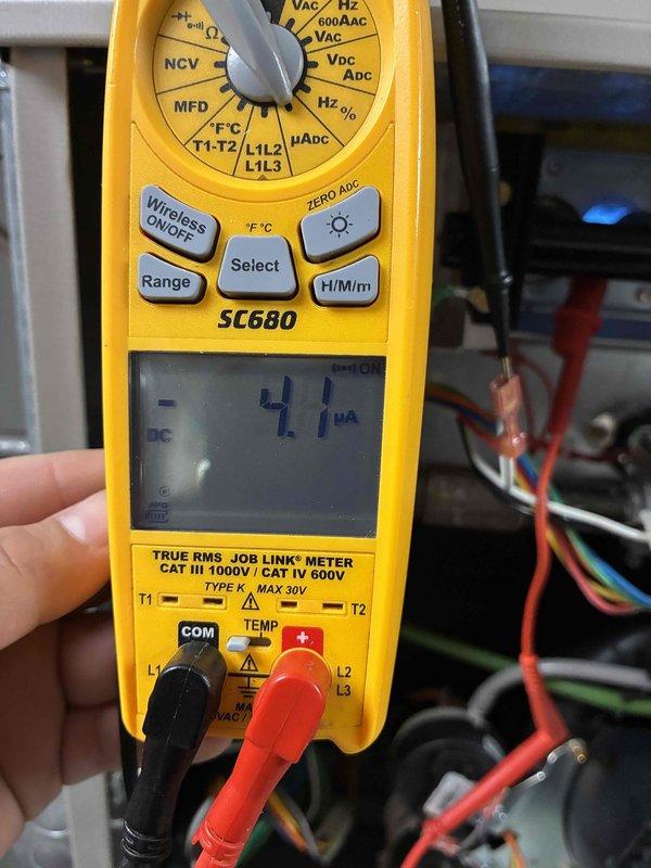 Performed scheduled maintenance on Carrier HVAC system. Replaced air filter and conducted electrical diagnostics using SC680 multimeter, measuring microamp draw (4.1 μA) to verify proper system operation. All components functioning within normal parameters.
