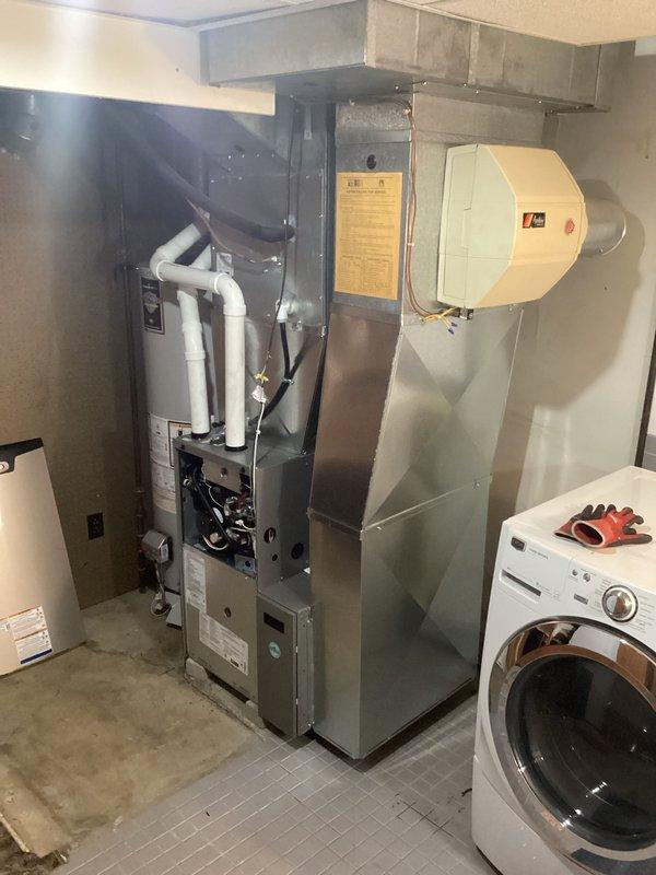 Successfully installed new furnace unit in utility room alongside existing water heater. Completed proper connection of exhaust and intake PVC venting, and ensured all ductwork connections were secure. System tested and confirmed to be in normal working condition with no leaks or issues detected.