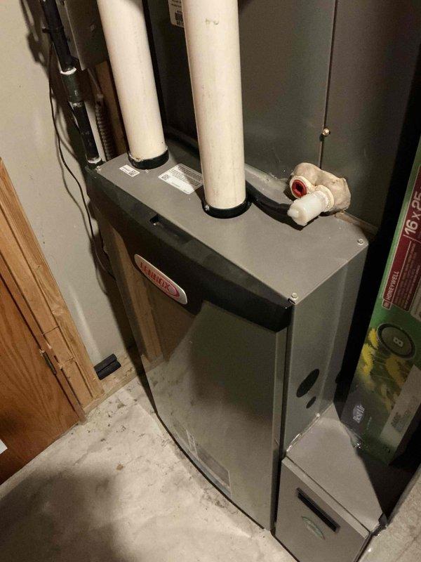 Performed routine tune-up service on Lennox furnace system. Inspected ventilation pipes and plumbing connections for proper installation and function. Temperature diagnostics showed normal operating parameters at 118.4°F on heat exchanger surface. All components tested within manufacturer specifications with no issues identified.