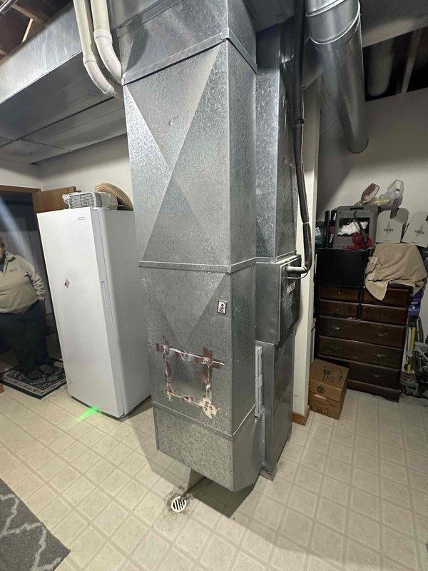 Conducted comprehensive assessment of existing HVAC system in basement utility area. Furnace unit showed signs of aging with compromised internal components visible upon cabinet inspection. Recommended complete system replacement to improve efficiency and reliability, as current installation has exceeded expected service life. Detailed documentation with photos was provided to support replacement recommendation.