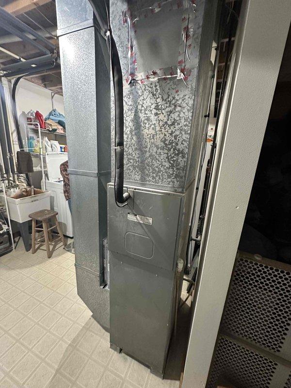 Conducted comprehensive assessment of existing HVAC system in basement utility area. Furnace unit showed signs of aging with compromised internal components visible upon cabinet inspection. Recommended complete system replacement to improve efficiency and reliability, as current installation has exceeded expected service life. Detailed documentation with photos was provided to support replacement recommendation.