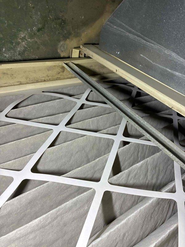 Performed routine HVAC tune-up service including inspection and evaluation of the Space-Gard air cleaner system. Examined the existing air filter which showed significant dust accumulation and possible mold growth in surrounding area. Replaced the dirty pleated filter with a new one to ensure proper system airflow and improved indoor air quality.