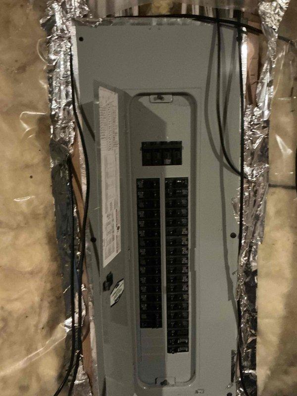 Conducted inspection of existing outdoor heat pump unit showing signs of age and wear, operating in snowy conditions. Examined electrical connections at the circuit breaker panel, noting current wiring configuration and load capacity. Prepared estimate for complete system replacement to improve efficiency and reliability.