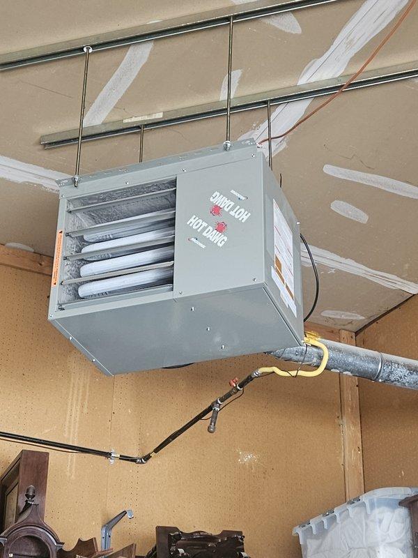 Responded to a no-heat service call for a Modine HotDawg ceiling-mounted unit located in garage workshop area. Performed diagnostic testing and identified faulty gas valve preventing proper ignition sequence. Replaced gas valve, verified proper gas pressure, and confirmed complete ignition cycle with normal flame pattern. Unit now operating within manufacturer specifications and providing adequate heat output.