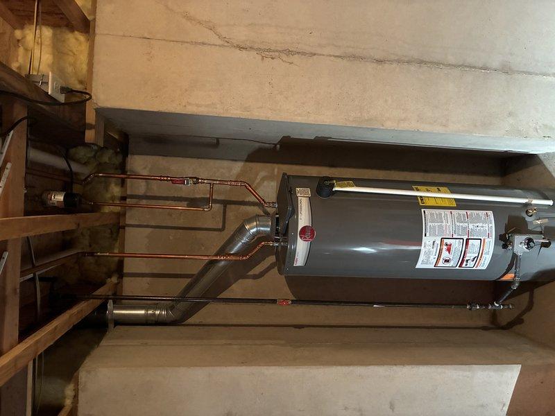 Installed a new tanked water heater in the basement utility area, connecting it to the existing copper supply lines with proper valves. Ensured all connections were secure and leak-free, with appropriate venting to meet current code requirements.
