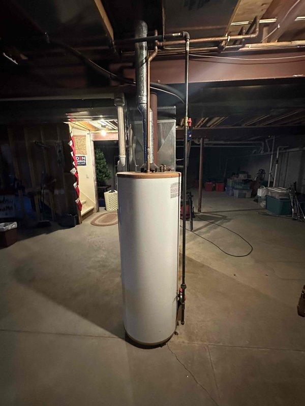 Conducted inspection of existing water heater system in unfinished basement showing signs of rust and deterioration. Provided estimate for complete replacement of aging unit, including new connections to existing copper supply lines and proper venting. Recommended upgrading to more efficient model based on household needs and current mechanical room configuration.