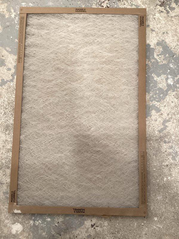 Responded to no-heat call for unit less than 10 years old. Inspection revealed heavily clogged air filter (MANN+HUMMEL) restricting proper airflow. Removed and replaced filter, checked blower motor and electrical connections on control board. Verified gas valve operation and proper airflow through the system. Unit now functioning normally with restored heat output.