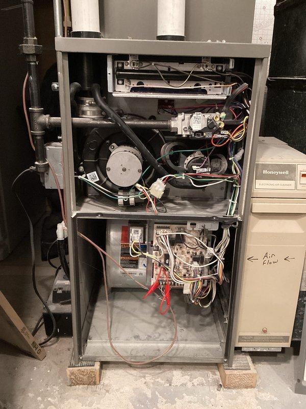 Responded to no-heat call for unit less than 10 years old. Inspection revealed heavily clogged air filter (MANN+HUMMEL) restricting proper airflow. Removed and replaced filter, checked blower motor and electrical connections on control board. Verified gas valve operation and proper airflow through the system. Unit now functioning normally with restored heat output.