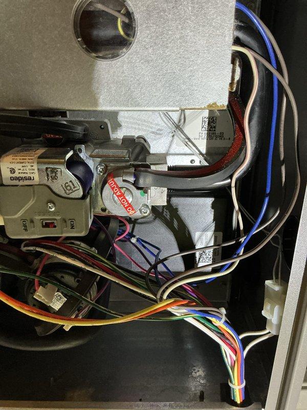Performed routine maintenance tune-up on customer's Lennox HVAC system. Inspected interior control board, verified all electrical connections were secure, and examined wiring for any signs of wear or damage. System is operating within normal parameters with no issues detected.