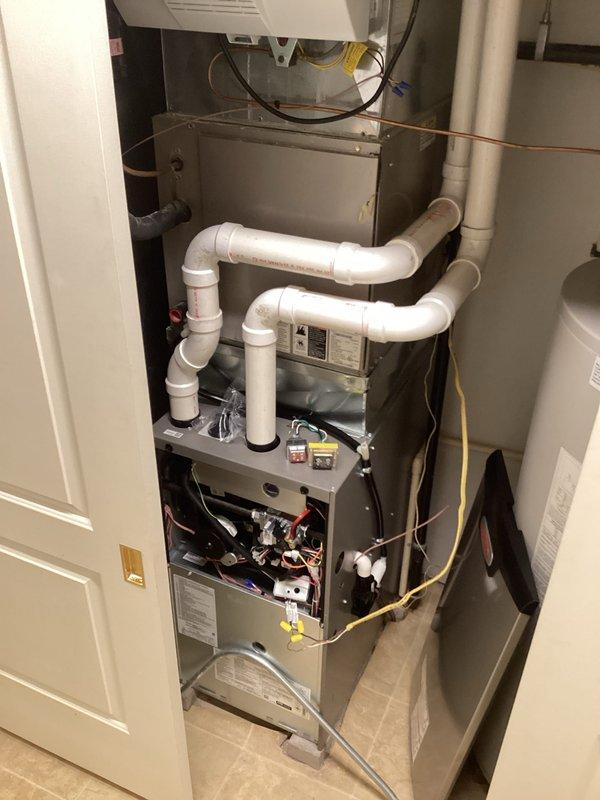Successfully installed a new high-efficiency furnace system in the utility room, complete with properly configured PVC ventilation piping and all necessary electrical connections. Performed comprehensive setup of control systems and verified proper operation of all components. Installation includes proper routing of condensate lines and integration with existing water heater infrastructure.