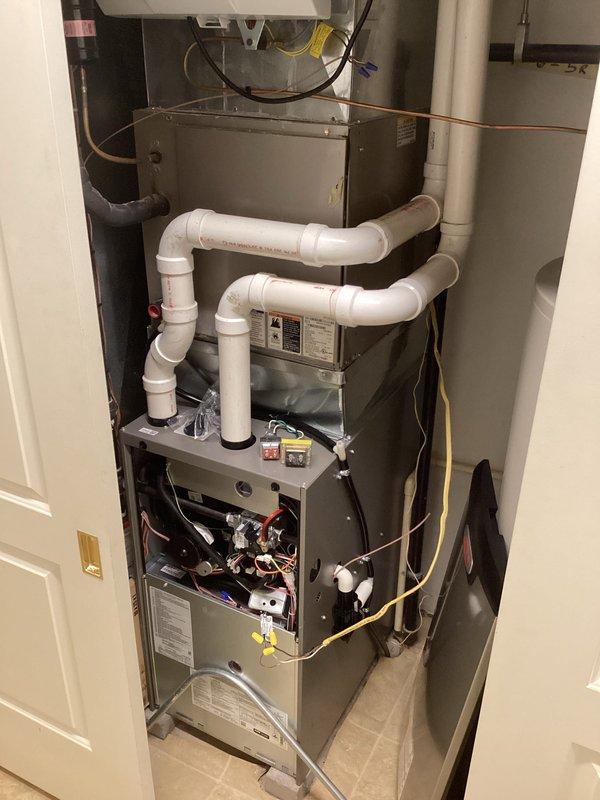 Successfully installed a new high-efficiency furnace system in the utility room, complete with properly configured PVC ventilation piping and all necessary electrical connections. Performed comprehensive setup of control systems and verified proper operation of all components. Installation includes proper routing of condensate lines and integration with existing water heater infrastructure.