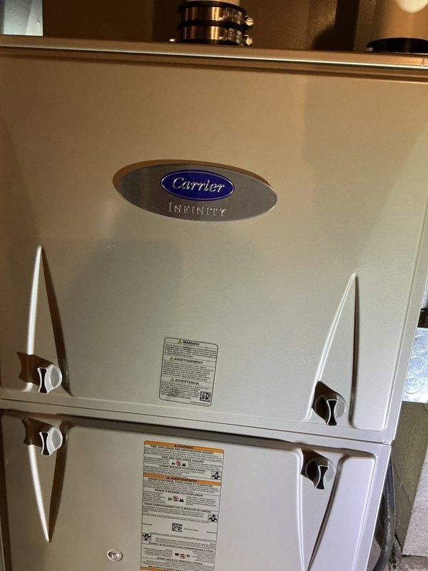 Performed routine maintenance on Carrier Infinity HVAC system. Inspected and cleaned all components of the air handler unit. Checked PVC condensate drain lines for proper flow and verified electrical connections were secure. System is operating within normal parameters with no issues detected.