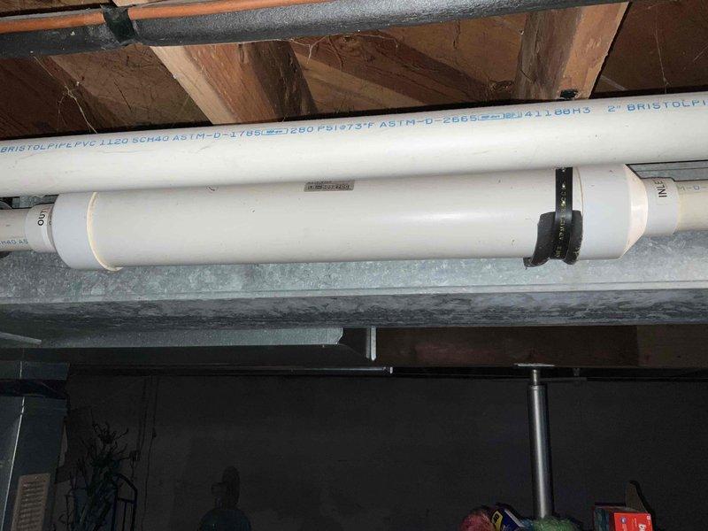 Performed inspection of existing Lennox Pulse furnace showing significant age deterioration and outdated technology. Documented current installation including PVC venting configuration and basement utility space constraints. Recommended complete system replacement with modern high-efficiency unit to address reliability concerns, improve energy efficiency, and ensure proper ventilation standards per current code requirements.