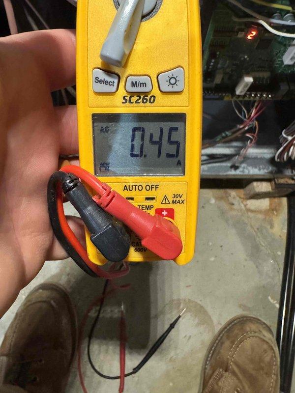 Performed routine HVAC tune-up service including electrical inspection with multimeter (SC260) showing 0.45 AC voltage reading within normal parameters. Conducted pressure testing using dual port manometer with readings of 154 on both ports, verifying proper system pressure balance. All measurements were within manufacturer specifications, confirming system is operating efficiently.