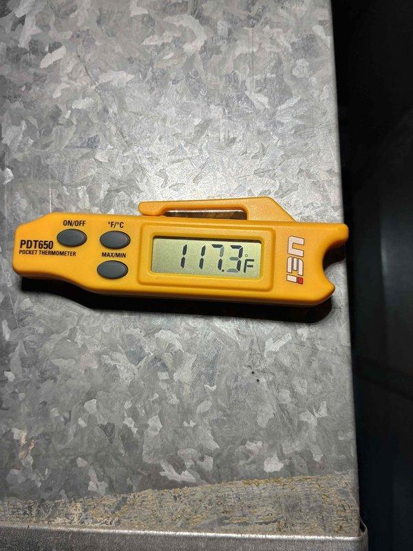 Performed scheduled prepaid maintenance visit on HVAC system. Inspected electrical connections and wiring, confirming proper installation with secure zip ties. Measured supply air temperature at 117.3°F using UEi PDT650 thermometer, verifying system is operating within normal temperature range.