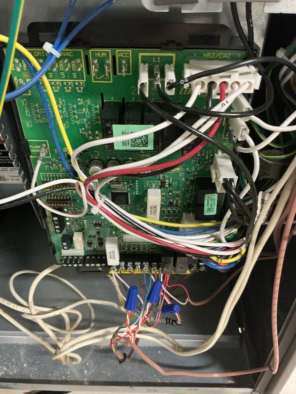 Performed standard prepaid maintenance visit on gas furnace system. Inspected control board connections and verified proper wire terminal connections. Observed burner assembly with normal blue flame pattern indicating proper gas combustion and operation.