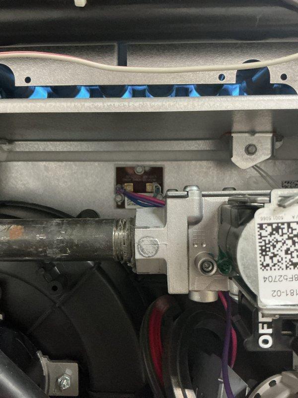 Performed standard prepaid maintenance visit on gas furnace system. Inspected control board connections and verified proper wire terminal connections. Observed burner assembly with normal blue flame pattern indicating proper gas combustion and operation.