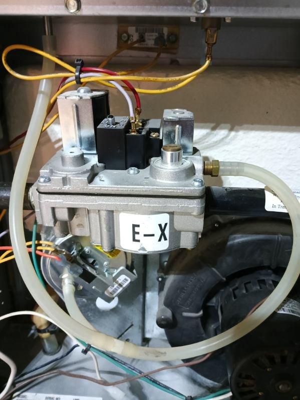 Responded to no heat complaint for a gas furnace less than 10 years old. Inspection revealed faulty gas valve (E-X model) with electrical connection issues. Replaced defective gas valve, verified proper ignition sequence, and confirmed normal system operation throughout heating cycle. Unit now functioning correctly with appropriate flame characteristics and temperature rise.