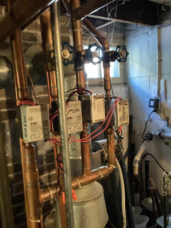 Performed comprehensive inspection of multi-zone hydronic heating system. Identified and cleaned corrosion on copper piping and zone control valves. Tested all zone control modules and actuators, confirming proper operation of electrical components and flow control through all circuits.