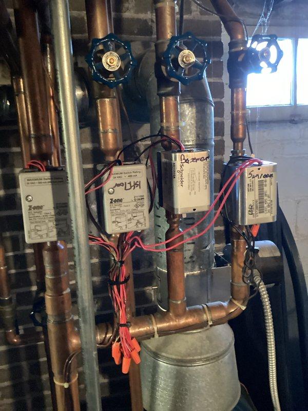 Performed comprehensive inspection of multi-zone hydronic heating system. Identified and cleaned corrosion on copper piping and zone control valves. Tested all zone control modules and actuators, confirming proper operation of electrical components and flow control through all circuits.