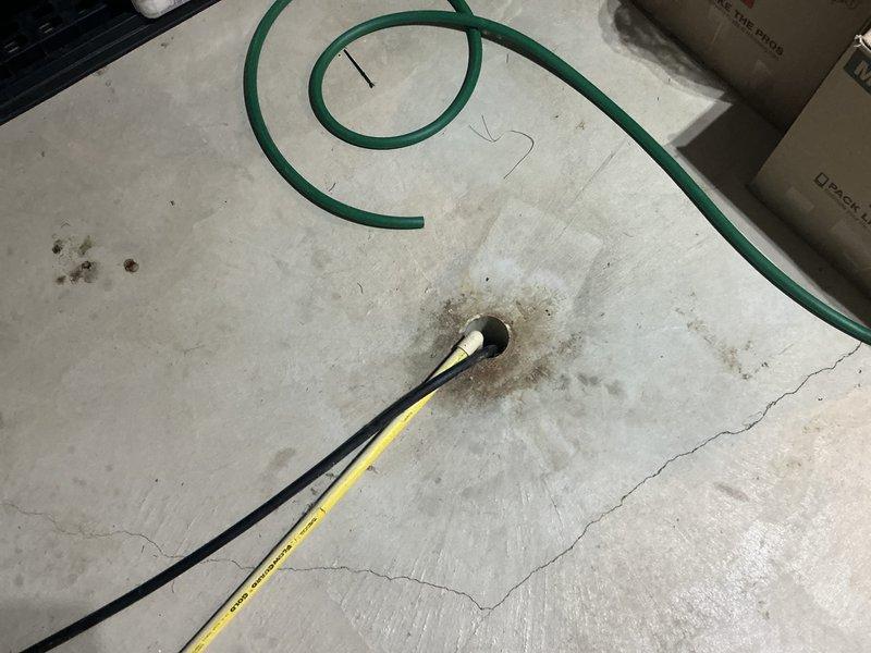 Conducted a site inspection for HVAC system replacement. Examined existing utility connections including electrical wiring access through concrete floor and exterior plumbing/refrigerant line configuration. Documented current installation conditions to prepare comprehensive replacement estimate.