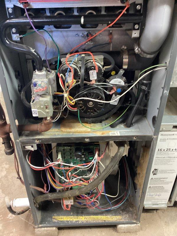 Performed comprehensive tune-up on residential HVAC system. Inspected and serviced furnace components including blower motor assembly, circuit board connections, and gas line fittings. Replaced worn coupling component on motor assembly and verified proper electrical connections to ensure optimal system performance.