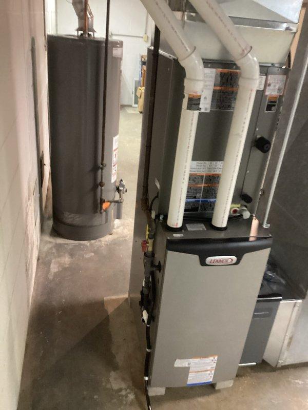 Successfully installed a complete Lennox HVAC system in the customer's residence, including proper connection to the existing Generac transfer switch. System installation included furnace unit with PVC venting and all necessary electrical and plumbing connections. Final inspection confirmed proper operation of all components in winter conditions.