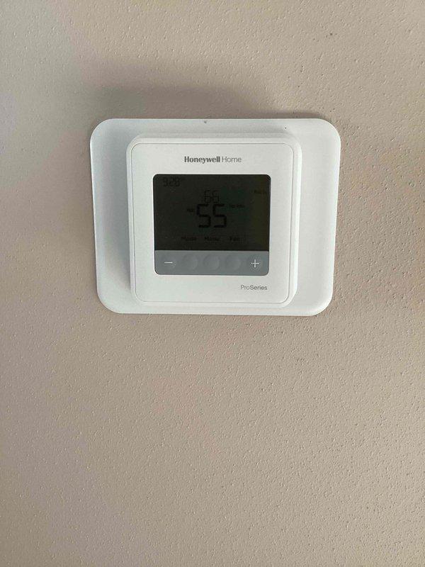 Completed installation of a new furnace system with a Honeywell Home ProSeries digital thermostat. System was properly calibrated and tested, with the thermostat successfully programmed and functioning at the set temperature of 55 degrees. Verified proper system pressure using Magnehelic gauge, confirming readings within manufacturer specifications.
