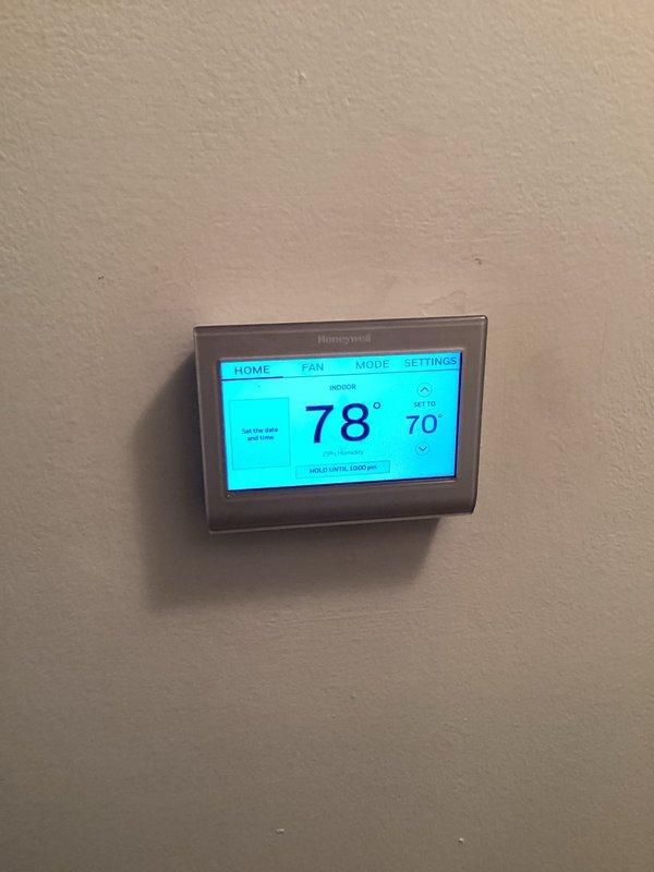 Performed comprehensive HVAC system tune-up including inspection of furnace internal components and wiring connections. Tested electrical systems with multimeter to verify proper voltage and functionality. Checked and confirmed Honeywell thermostat operation, noting current temperature (78°) versus set point (70°) to ensure proper communication with the HVAC system.