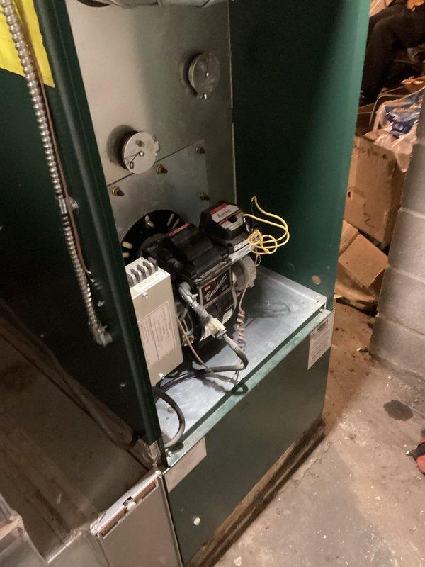 Performed comprehensive tune-up on older model furnace unit. Accessed internal components for inspection and cleaning. Conducted combustion analysis using Bacharach analyzer, which revealed O₂ at 5.7%, CO at 42 ppm, efficiency at 82.9%, and CO₂ at 11.3%. System is functioning within acceptable parameters but operating at moderate efficiency.