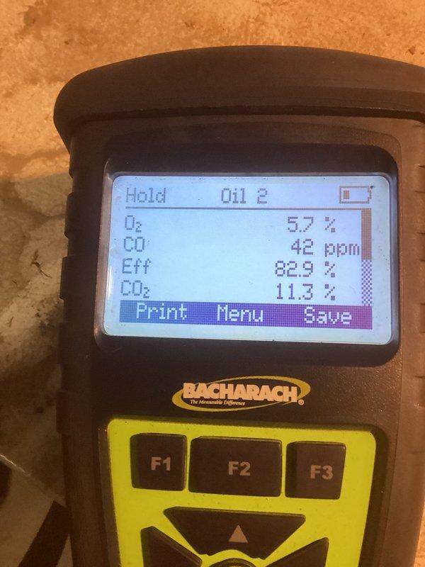 Performed comprehensive tune-up on older model furnace unit. Accessed internal components for inspection and cleaning. Conducted combustion analysis using Bacharach analyzer, which revealed O₂ at 5.7%, CO at 42 ppm, efficiency at 82.9%, and CO₂ at 11.3%. System is functioning within acceptable parameters but operating at moderate efficiency.