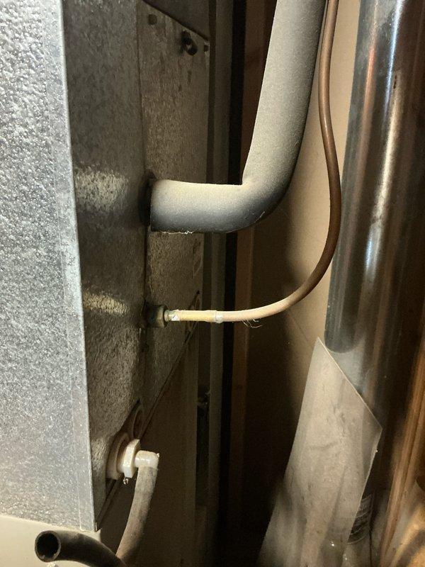 Conducted assessment for HVAC system replacement. Inspected existing equipment components including insulated refrigerant lines and copper tubing. Evaluated workspace conditions and equipment placement options in garage/workshop area. Prepared estimate for complete system replacement based on visual inspection findings.