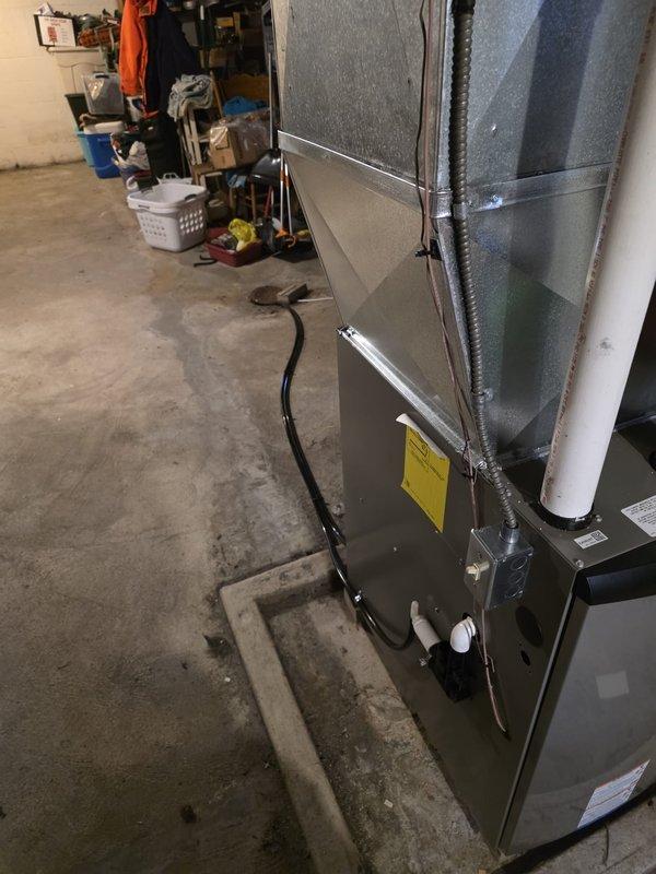 Successfully installed new high-efficiency furnace in basement utility area, including proper connection of intake/exhaust PVC venting system and gas line. Installed condensate drainage system with proper routing to floor drain, and completed all necessary connections to existing ductwork.
