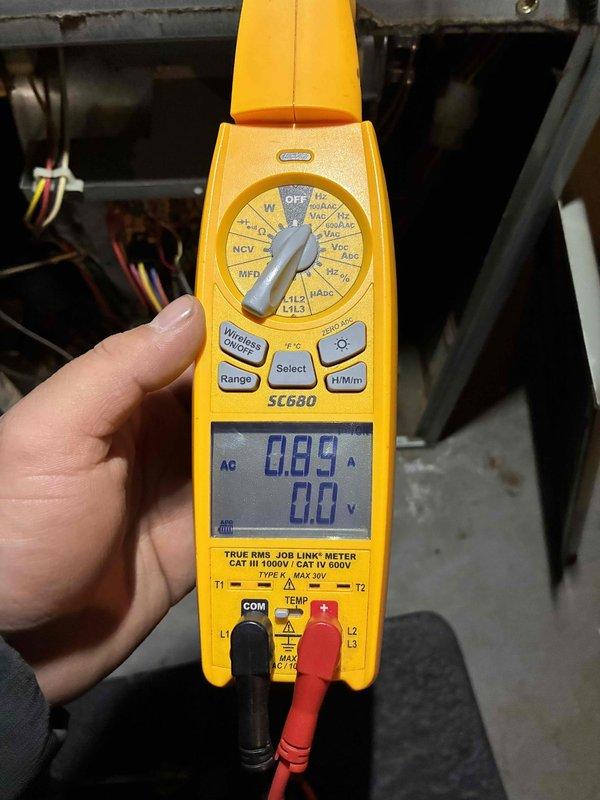 Diagnosed electrical issue on aging heating system using Fieldpiece SC680 multimeter. Performed amperage and voltage testing on system components, measuring 0.89A current draw. System restored to proper operation after electrical troubleshooting and necessary repairs.