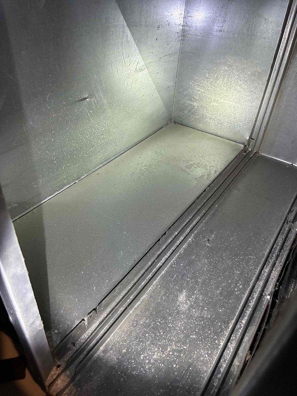 Performed routine maintenance tune-up on HVAC system. Inspected interior metal compartment for wear and debris. Conducted electrical testing using Fieldpiece SC680 clamp meter, confirming amperage reading of 1.05A with voltage verification at 0.0V, indicating proper electrical parameters within manufacturer specifications.