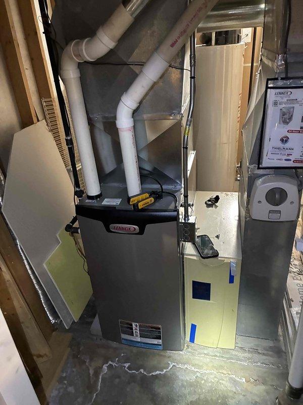 Performed routine maintenance tune-up on Lennox furnace system. Conducted electrical diagnostics using Fieldpiece SC680 multimeter, confirming proper voltage readings at 26.4V. Inspected PVC exhaust venting configuration and verified all connections were secure with no signs of leakage or deterioration.