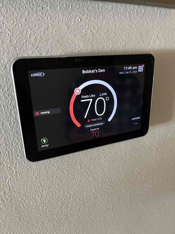 Completed routine prepaid maintenance service on Lennox HVAC system. Inspected and verified proper operation of digital thermostat displaying accurate temperature readings and heating mode functionality. Examined furnace unit, ductwork, and condensate lines with all components found to be in normal working condition.