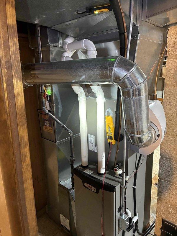 Completed routine prepaid maintenance service on Lennox HVAC system. Inspected and verified proper operation of digital thermostat displaying accurate temperature readings and heating mode functionality. Examined furnace unit, ductwork, and condensate lines with all components found to be in normal working condition.