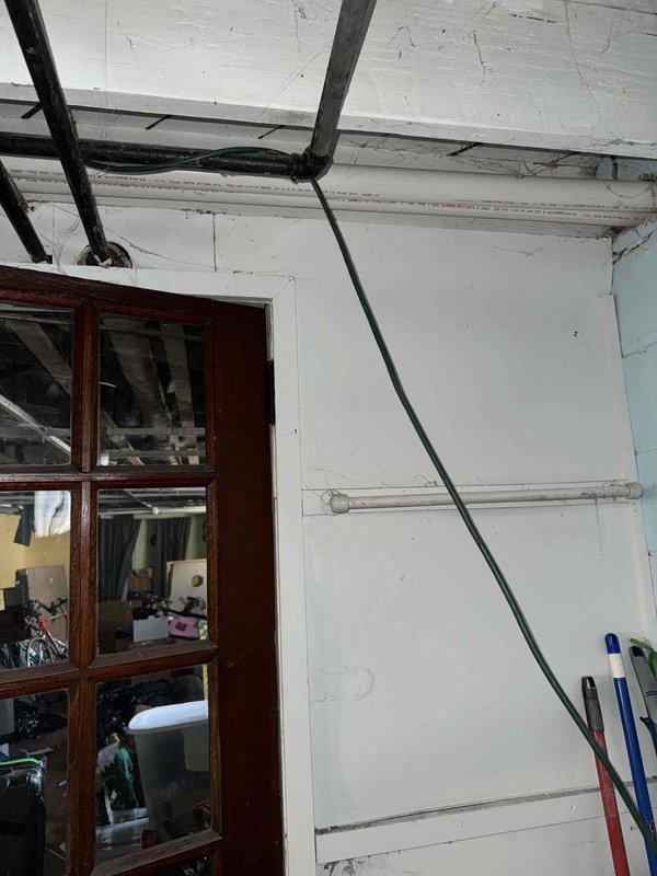 Performed warranty inspection of HVAC system in basement utility area. Examined ductwork, refrigerant lines, and drainage system. Verified proper installation of main air handler and associated piping. No current issues identified with the system operation or installation.