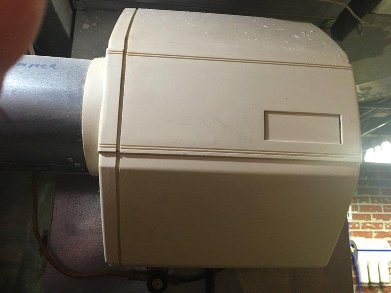 Performed scheduled tune-up on HVAC system with focus on Aprilaire humidifier unit. Inspected control panel which showed signs of wear with dial positioned between OFF and 15% settings. Examined humidifier housing mounted to ductwork which displayed mineral deposits on top surface. Cleaned accessible components and verified proper connection to main system.