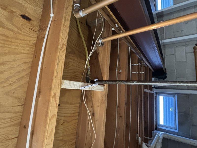 Inspected attic plumbing system, identifying exposed copper supply lines requiring proper insulation. Installed insulation wrap on all accessible copper pipes to prevent potential freezing and maintain system efficiency. Verified all connections remained secure after installation.