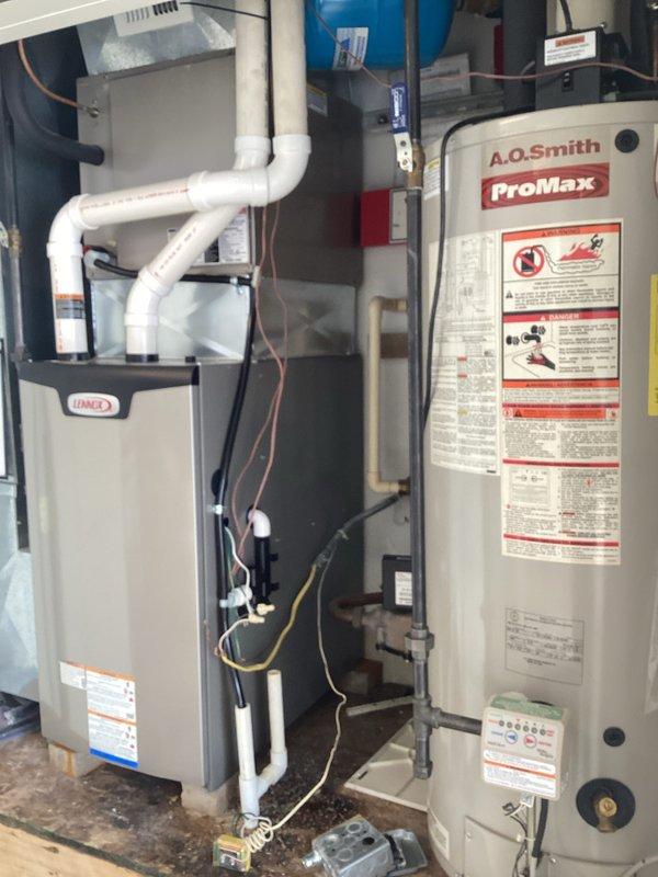 Successfully installed a new Lennox furnace in the residential mechanical room, completing all necessary PVC ventilation connections and ensuring proper integration with the existing A.O. Smith ProMax water heater system. All plumbing and electrical connections were properly secured and tested for optimal performance.