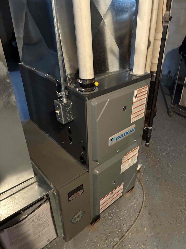 Completed thermostat replacement on Daikin HVAC system, installing new unit and connecting all control wiring (R, W, G, Y, B) according to manufacturer specifications. Verified proper system operation through heating and cooling cycle tests, ensuring communication between thermostat and furnace unit.