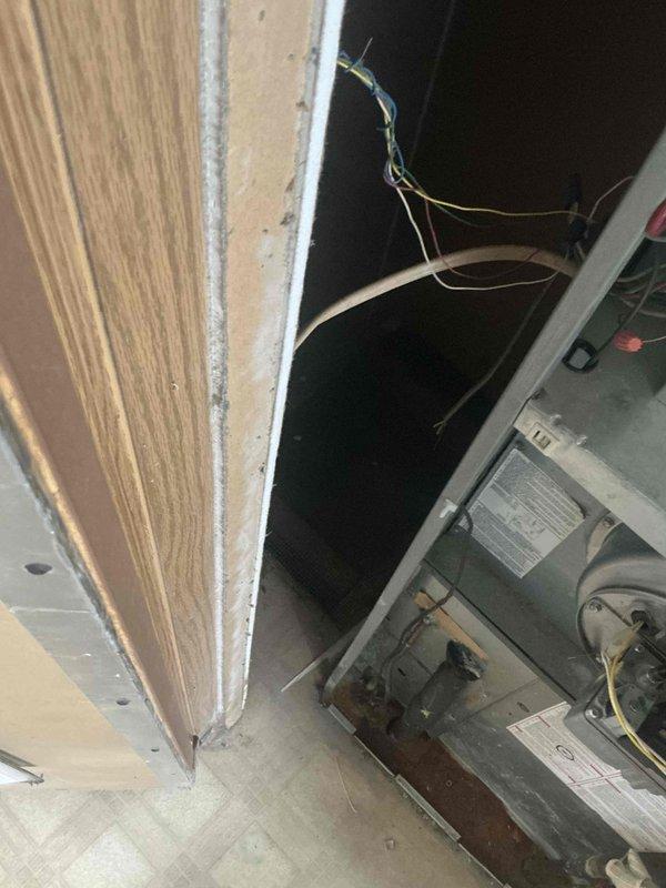 Conducted inspection of existing HVAC equipment through an access panel, revealing outdated unit with visible wiring issues. Provided estimate for complete system replacement, noting the current unit has reached end of service life and replacement would improve energy efficiency while ensuring proper integration with the home's existing doorways and layout.