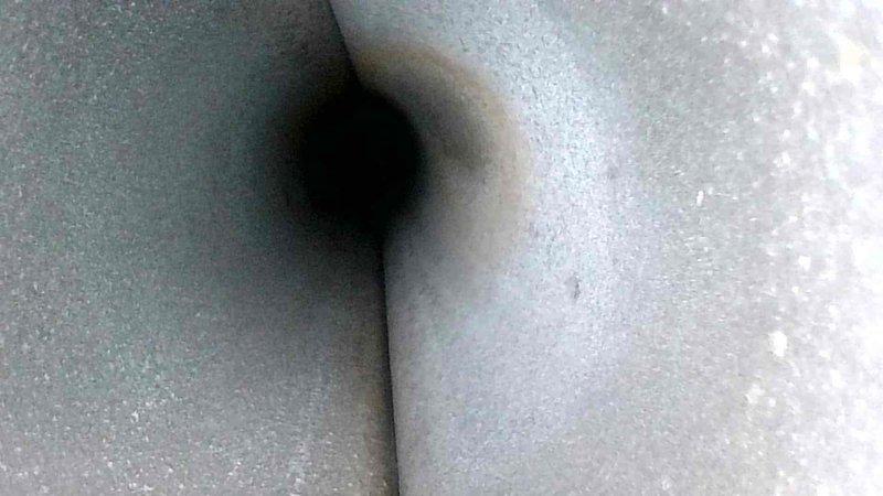 Conducted routine HVAC maintenance service with thorough inspection of duct system. Identified accumulated dust and minor degradation of insulation material in ventilation shaft. Performed visual assessment of interior ductwork to ensure proper airflow and system integrity.