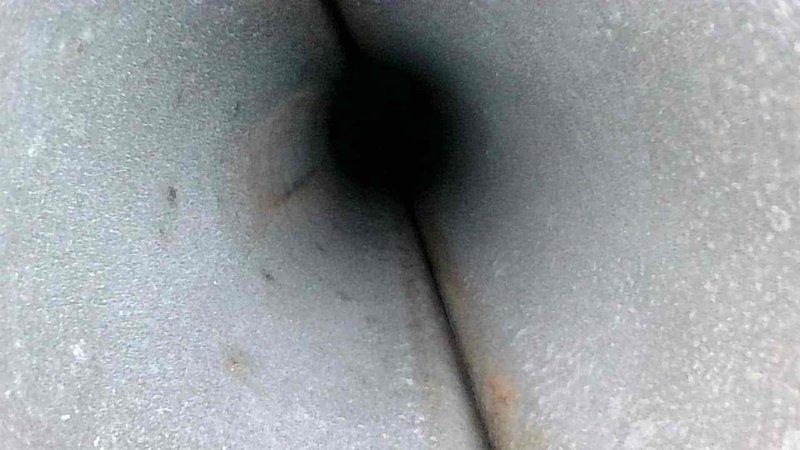 Conducted routine HVAC maintenance service with thorough inspection of duct system. Identified accumulated dust and minor degradation of insulation material in ventilation shaft. Performed visual assessment of interior ductwork to ensure proper airflow and system integrity.