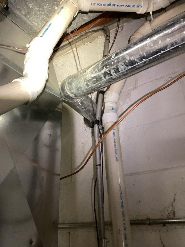Performed comprehensive prepaid maintenance service on residential HVAC system. Inspected furnace interior components including blower motor assembly, gas valve, control board, and electrical connections. Examined ductwork and PVC venting system in utility area, confirming proper installation and function of all components.